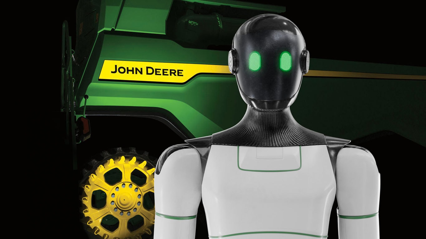 Image d’un robot devant une moissonneuse-batteuse