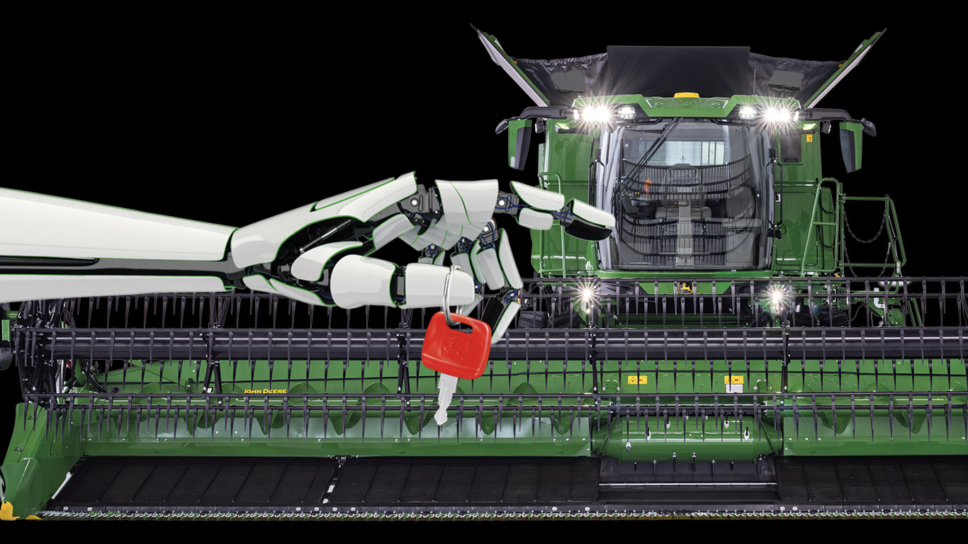 Robot hand holding red key in front of combine, symbolizing advanced agricultural technology.